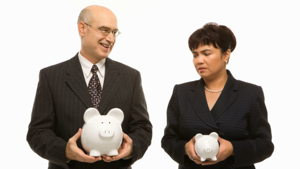 Man and woman with piggy banks